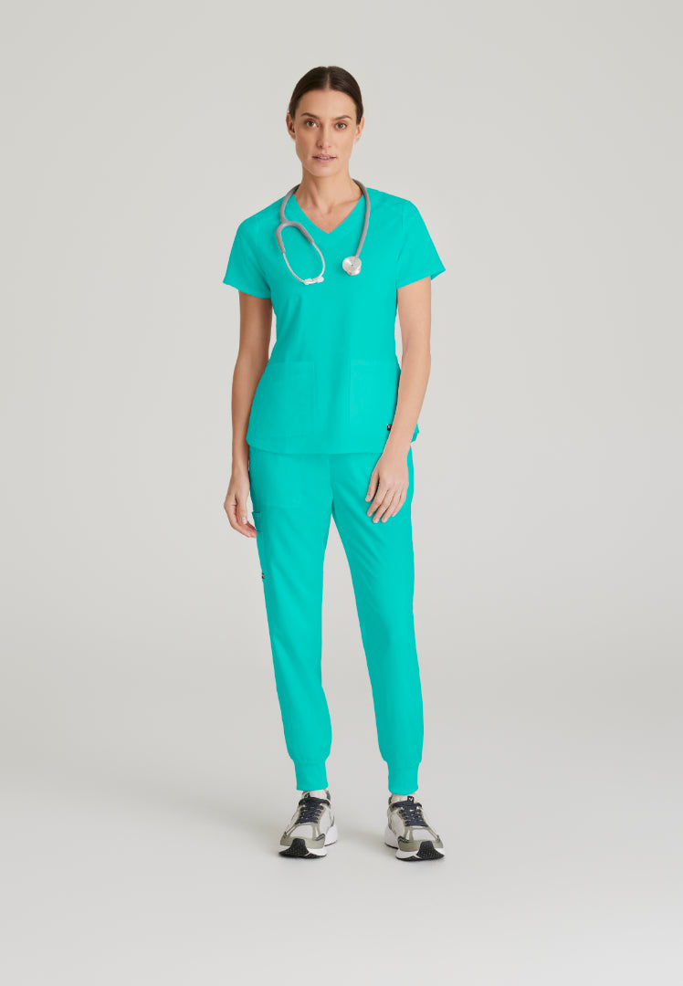 Blusa médica Emma con cuello en V y cuatro bolsillos - Aguamarina alpina