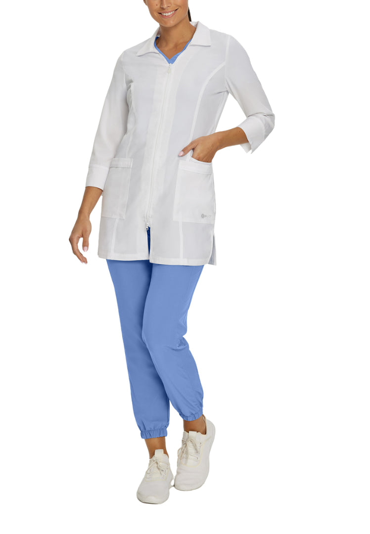Person wearing a White Cross 2417 lab coat and blue pants on a white background