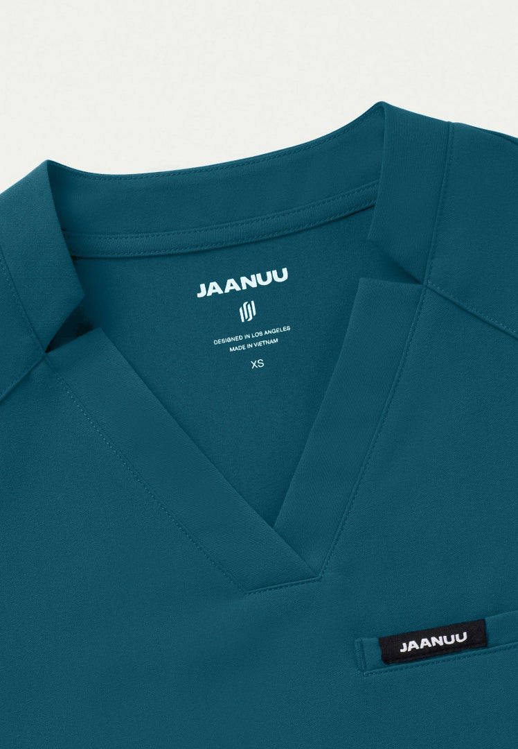 Blusa médica con cuello en V y muescas Helia - Azul Caribe