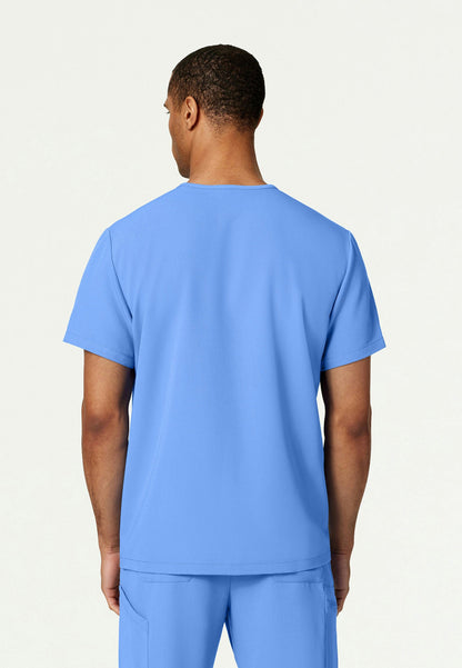 Back view of a man wearing a ciel blue Jaanuu Platt scrub shirt on a white background
