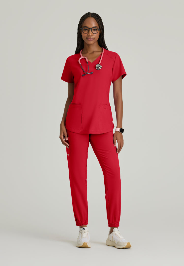 Grey's Anatomy™ Evolve "Rhythm" 2-Pocket Piped V-Neck Top - True Red