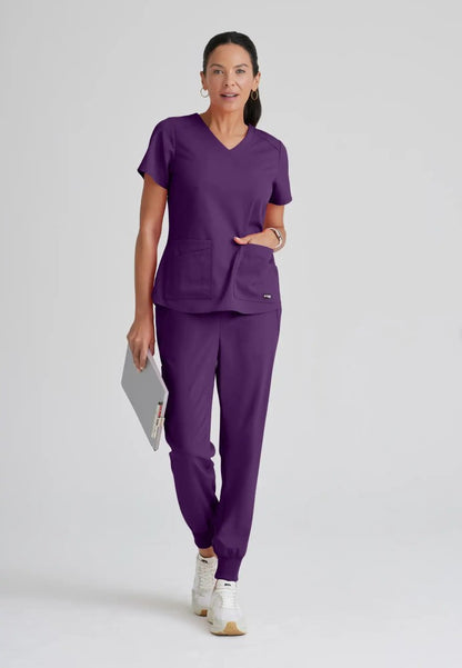 Grey's Anatomy™ Spandex Stretch "Emma" 4-Pocket V-Neck Scrub Top - Eggplant - The Uniform Store