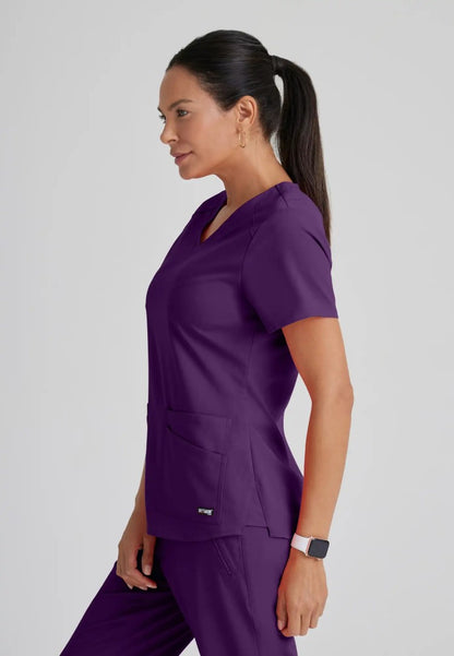 Grey's Anatomy™ Spandex Stretch "Emma" 4-Pocket V-Neck Scrub Top - Eggplant - The Uniform Store