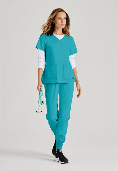Grey's Anatomy™ Spandex Stretch "Emma" 4-Pocket V-Neck Scrub Top - Teal - The Uniform Store