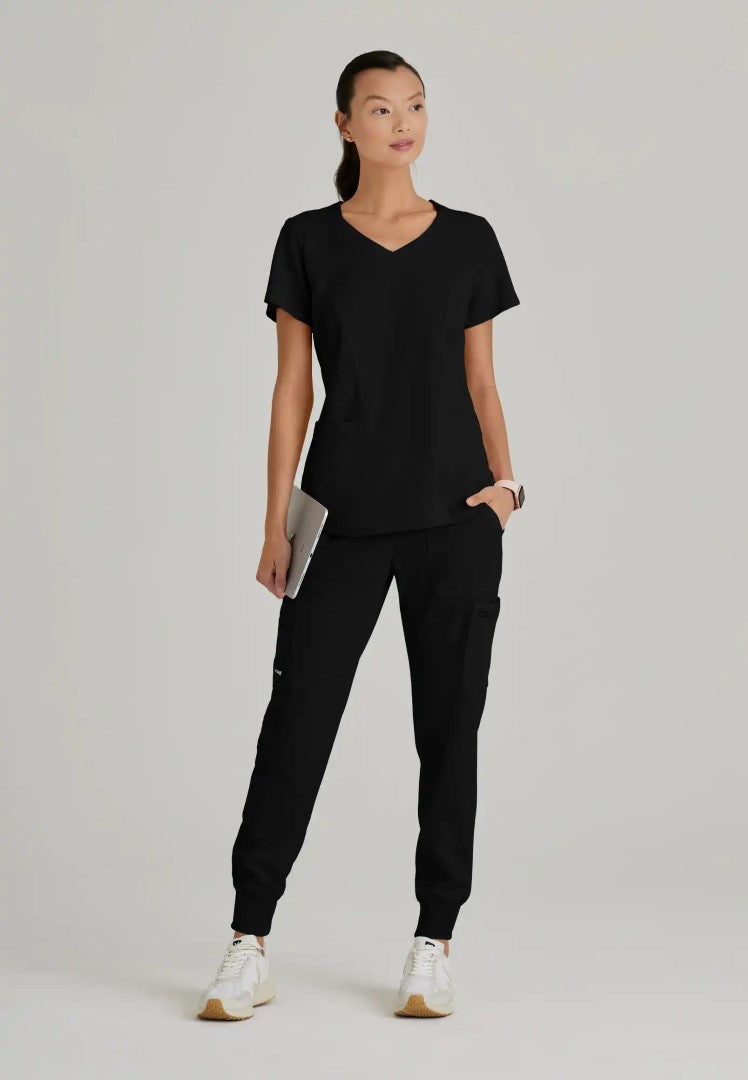 Grey's Anatomy™ Spandex Stretch "Carly" 3-Pocket Curved V-Neck Scrub Top - Black - The Uniform Store