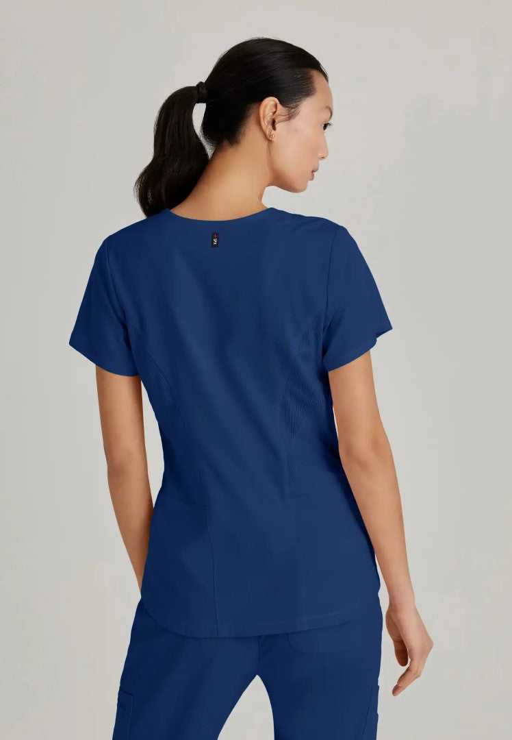 Grey's Anatomy™ Spandex Stretch "Carly" 3-Pocket Curved V-Neck Scrub Top - Indigo - The Uniform Store
