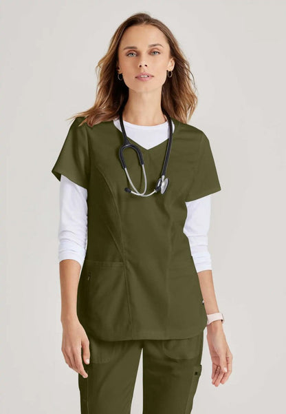 Grey's Anatomy™ Spandex Stretch "Carly" 3-Pocket Curved V-Neck Scrub Top - Olive - The Uniform Store
