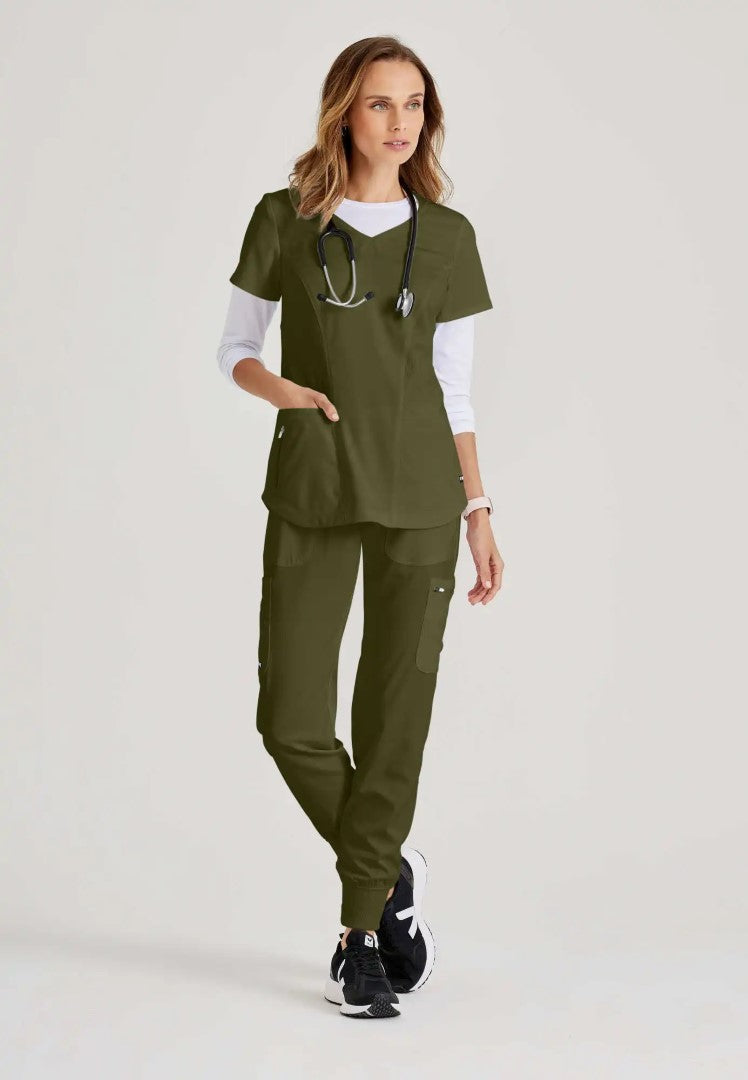 Grey's Anatomy™ Spandex Stretch "Carly" 3-Pocket Curved V-Neck Scrub Top - Olive - The Uniform Store