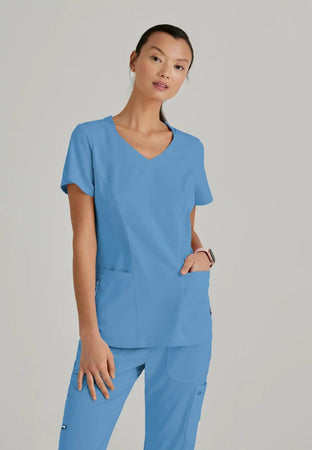 Grey's Anatomy™ Spandex-Stretch Carly 3-Pocket Curved V-Neck Scrub Top -  Ciel Blue