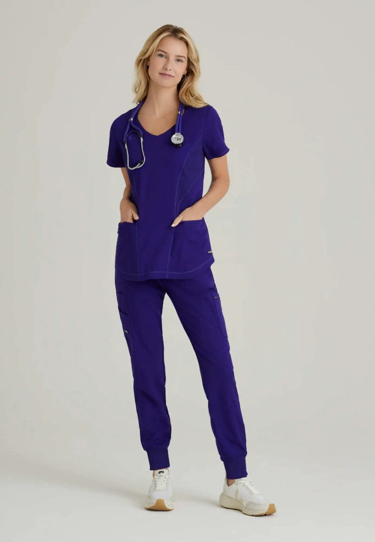 Grey's Anatomy™ Spandex Stretch "Carly" 3-Pocket Curved V-Neck Scrub Top - Brilliance - The Uniform Store