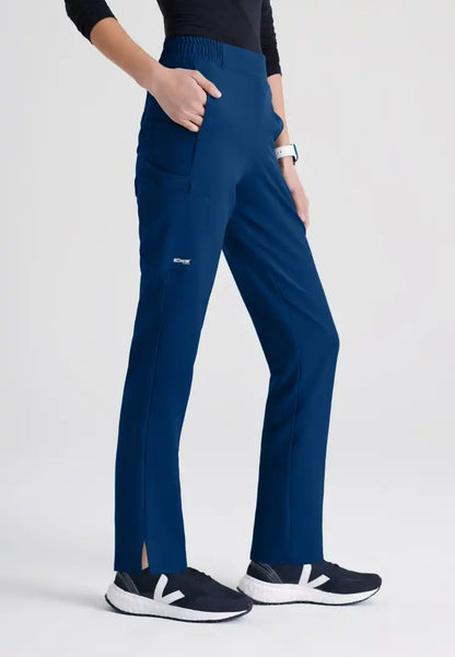 Grey's Anatomy™ Evolve "Cosmo" 6-Pocket Mid-Rise Tapered Leg Pant - Indigo - The Uniform Store