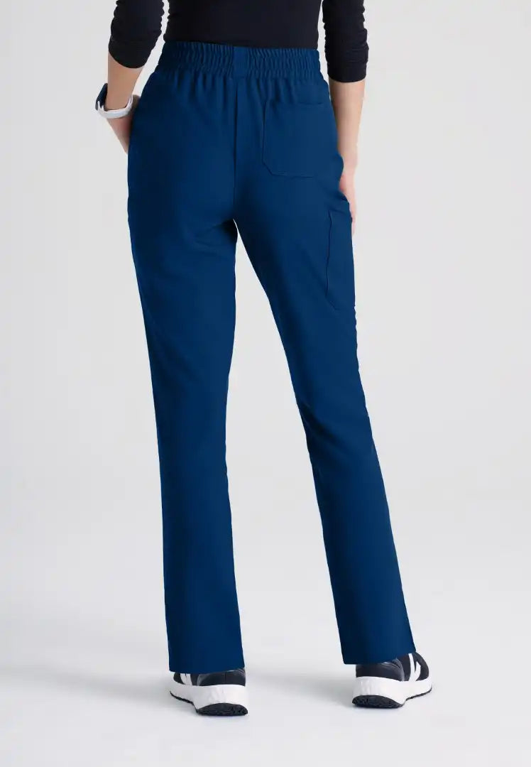 Grey's Anatomy™ Evolve "Cosmo" 6-Pocket Mid-Rise Tapered Leg Pant - Indigo - The Uniform Store