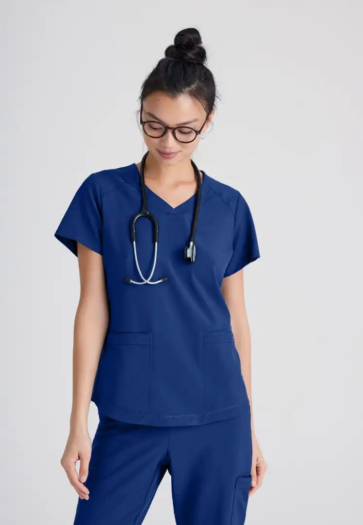 Grey's Anatomy™ Evolve "Rhythm" 2-Pocket Piped V-Neck Top - Indigo - The Uniform Store