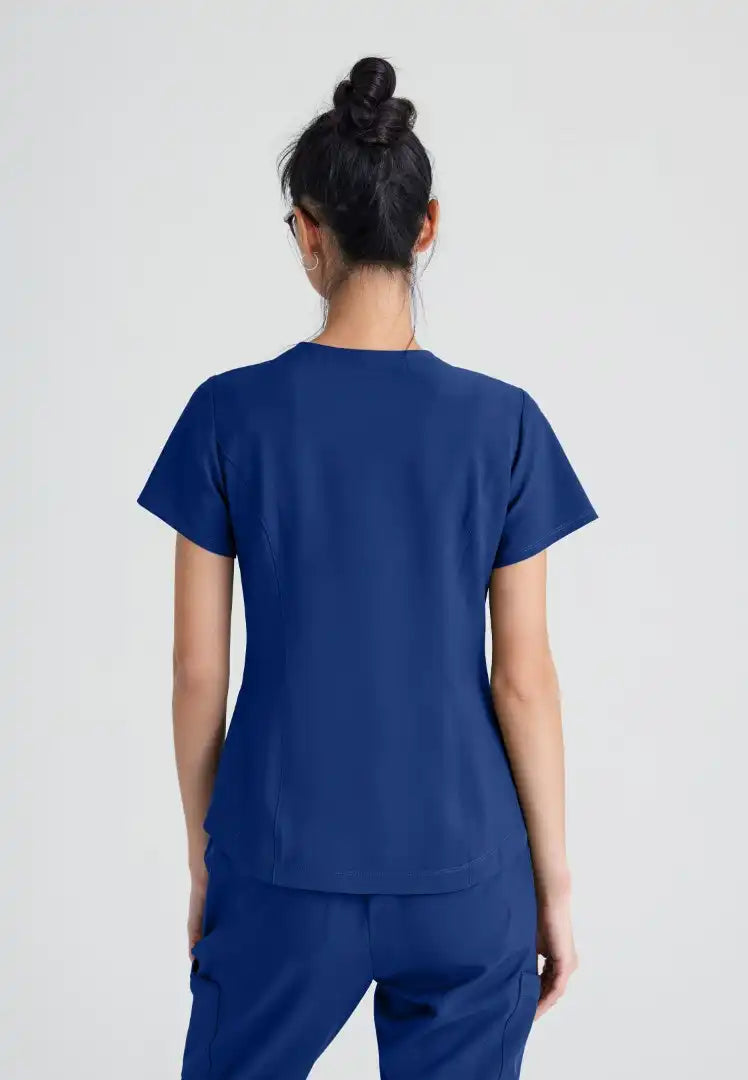 Grey's Anatomy™ Evolve "Rhythm" 2-Pocket Piped V-Neck Top - Indigo - The Uniform Store