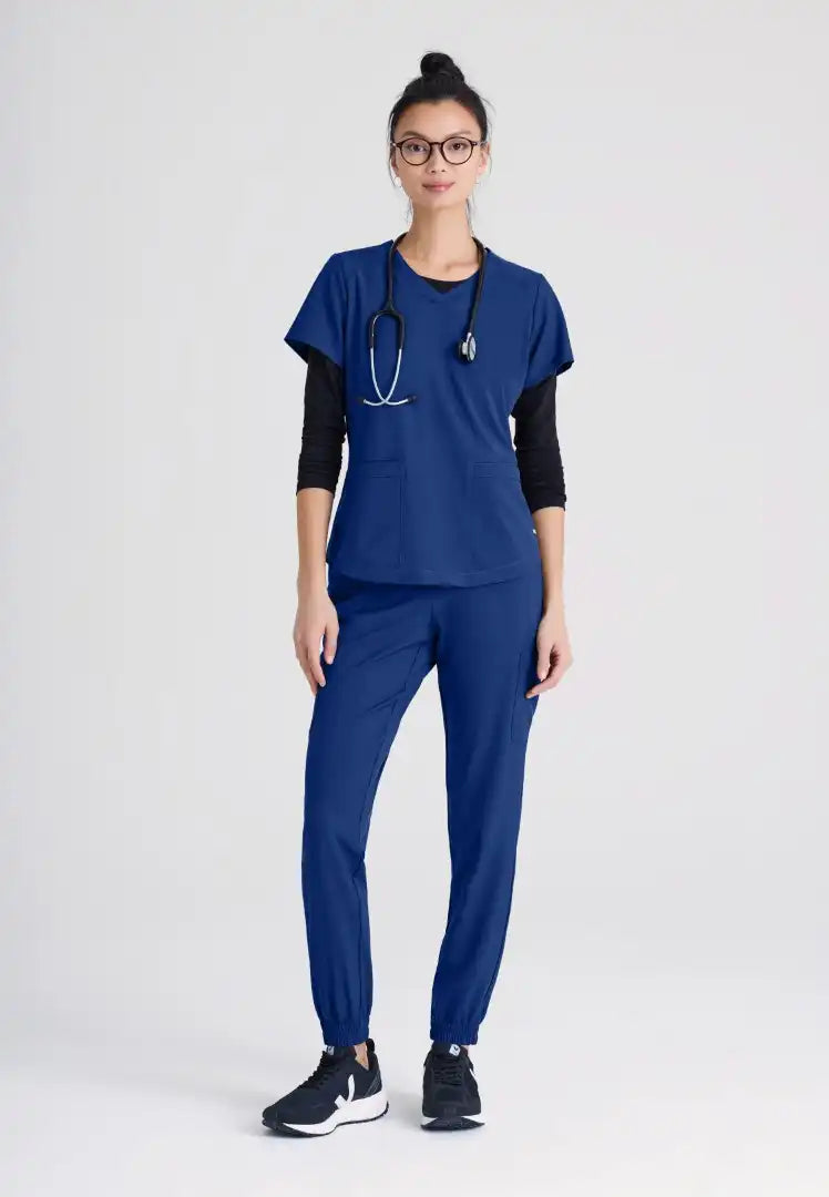 Grey's Anatomy™ Evolve "Rhythm" 2-Pocket Piped V-Neck Top - Indigo - The Uniform Store