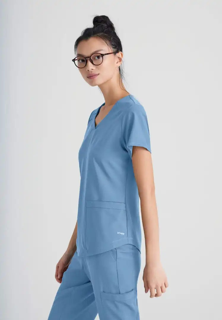 Grey's Anatomy™ Evolve "Rhythm" 2-Pocket Piped V-Neck Top - Ciel Blue - The Uniform Store