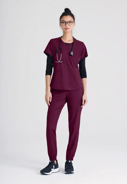 Grey's Anatomy™ Evolve "Rhythm" 2-Pocket Piped V-Neck Top - Wine - The Uniform Store