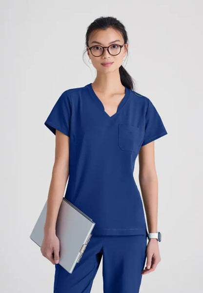 Grey's Anatomy™ Evolve "Sway" Banded V-Neck Tuck-In Top - Indigo - The Uniform Store