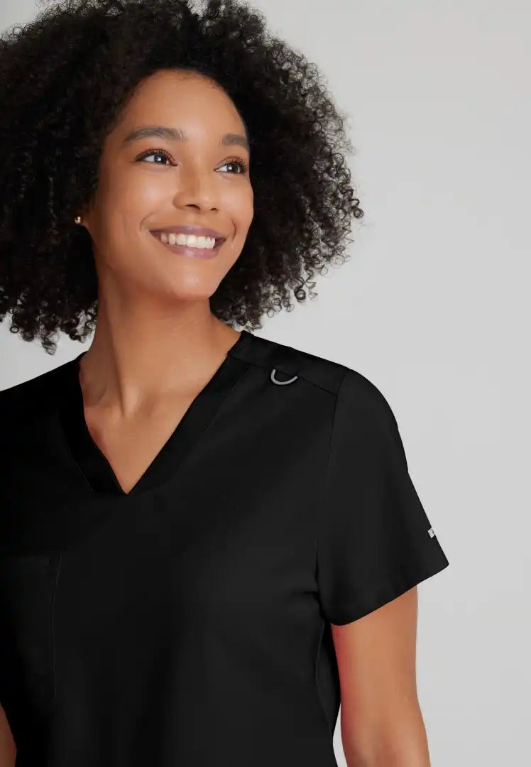 Grey's Anatomy™ Spandex Stretch "Bree" 1-Pocket Tuck In Top - Black - The Uniform Store