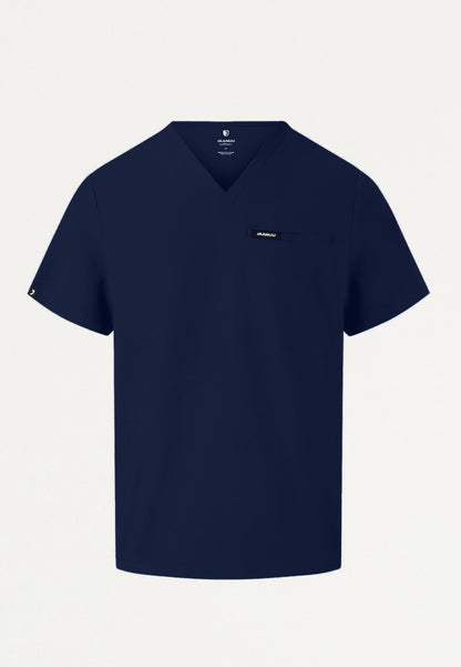Navy blue Jaanuu Platt v-neck scrub top with a small logo on a light gray background