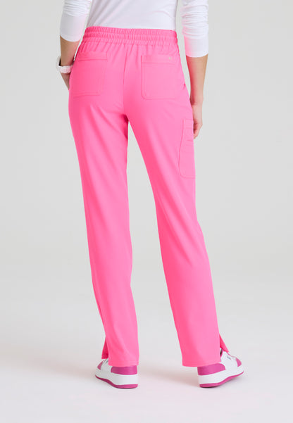 Back view of a woman wearing Skechers Passion Pink SKP623 scrub pants on a white background