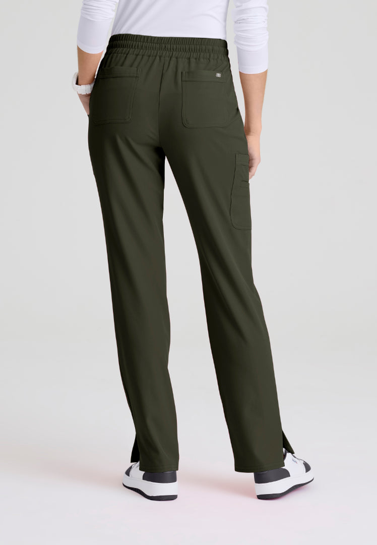 Back view of woman wearing olive green Skechers SKP623 scrub pants on a white background